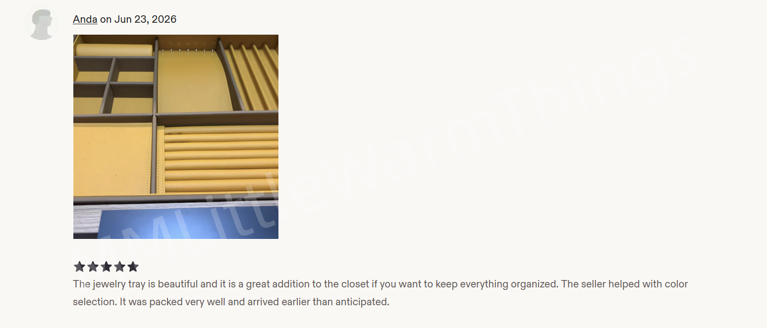 A customer review showing a photo of a jewelry organizer tray with brown-toned compartments and dark gray dividers, along with a five-star rating and a positive text review.
