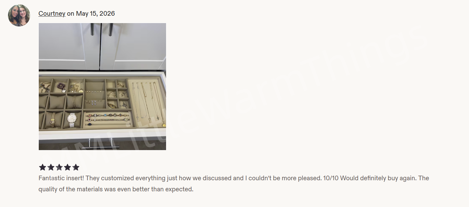 A customer review screenshot showing a jewelry organizer drawer with multiple compartments and a watch band, set against a light gray background with text below.